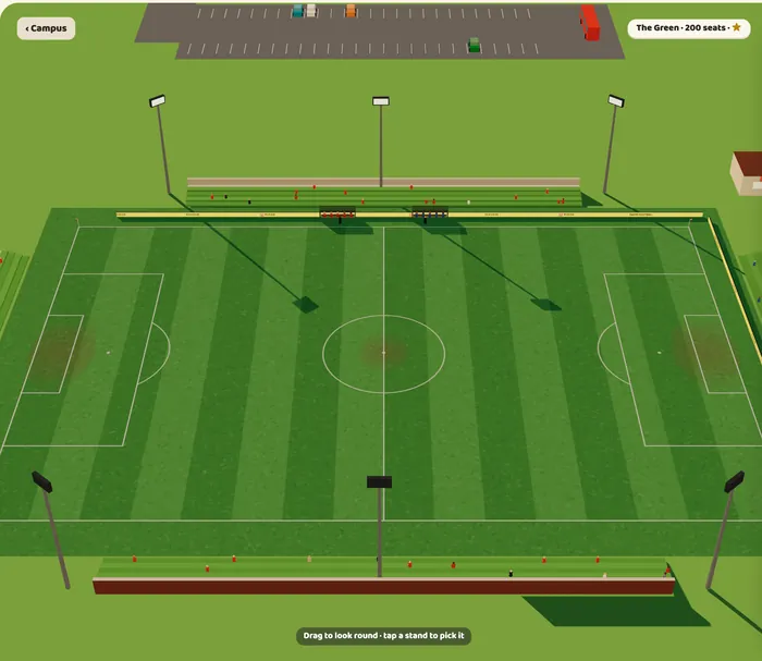 Day one at the ground: a pitch with a grass bank and a few benches